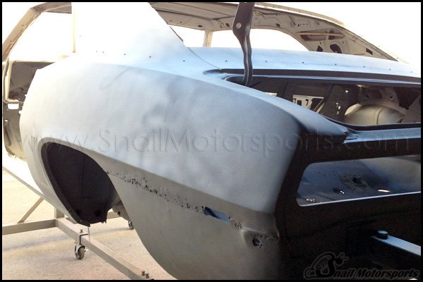 1969 Camaro rear quarter panel damage found after sand blasting