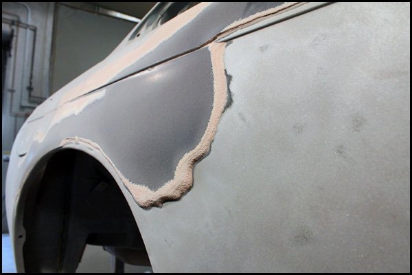 Nissan quarter panel removing bondo with sand blasting