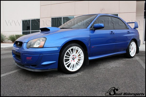 Subaru STI with Gloss White wheels and Pink lug nuts