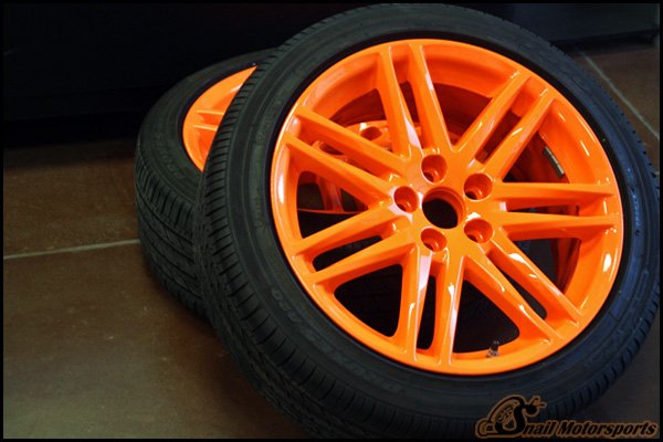 Scion tC factory wheels in Neon Orange
