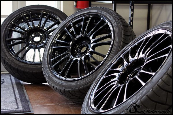 Subaru STI stock wheels in Gloss Black